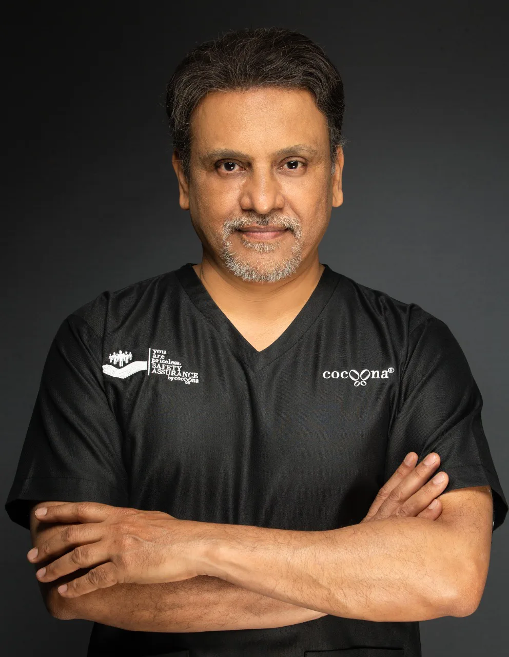 Dr. Sanjay Parashar in black scrubs, from the Arabian Business 50 Indian Power List, number 47