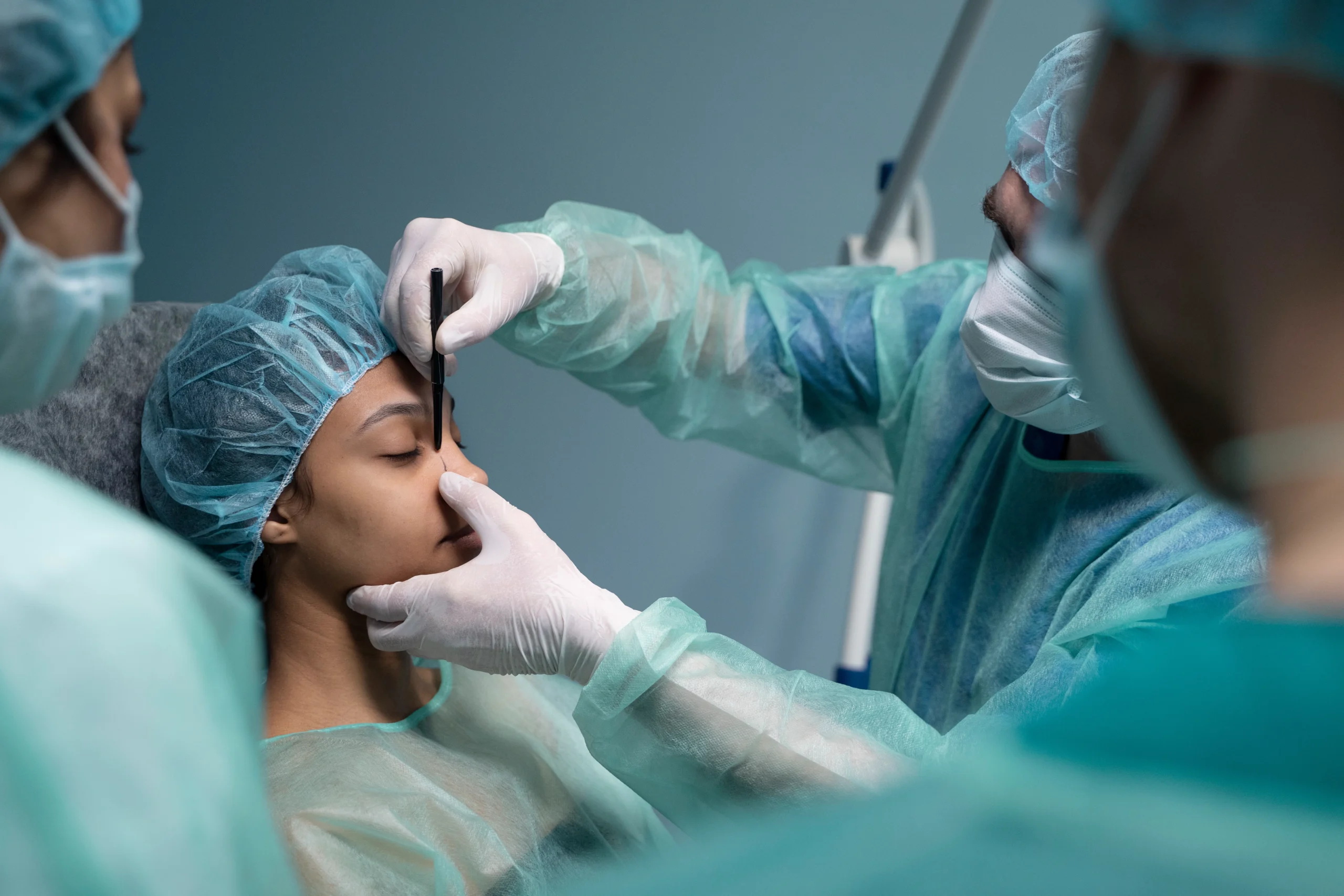 Dr. Sanjay Parashar consulting patient before rhinoplasty in Dubai