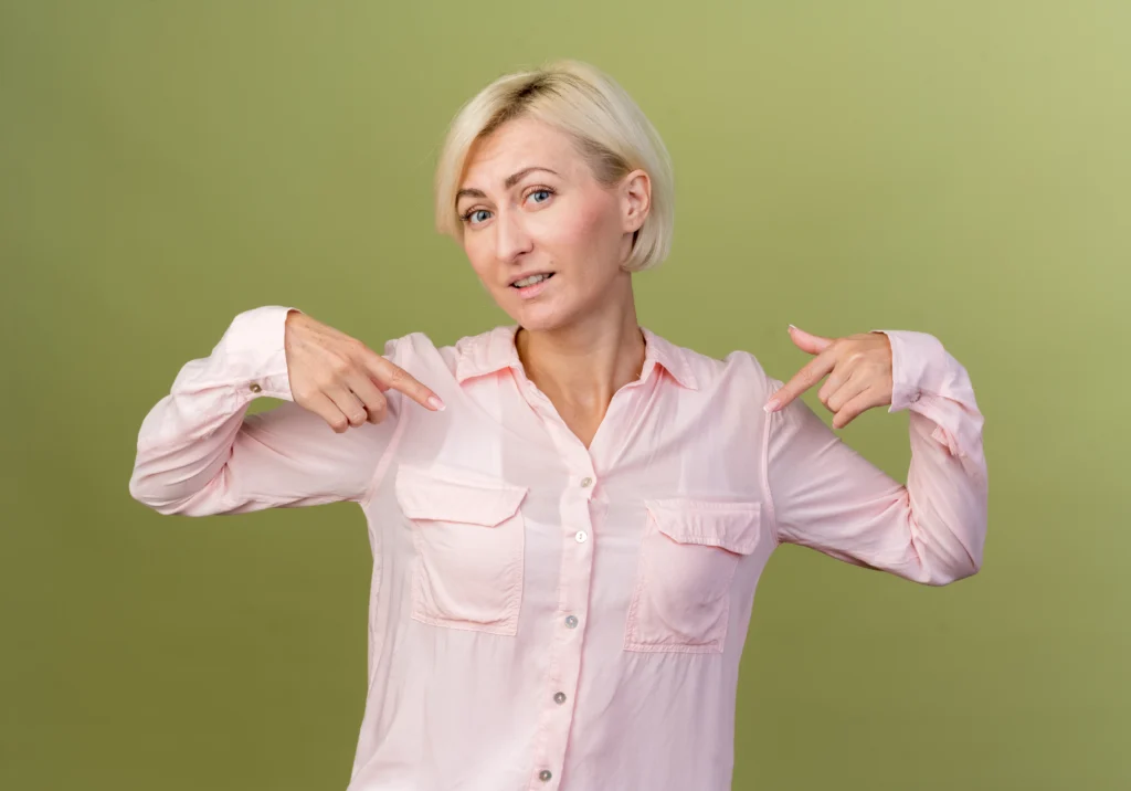 Surgeon explaining post-operative care during breast augmentation recovery in Dubai