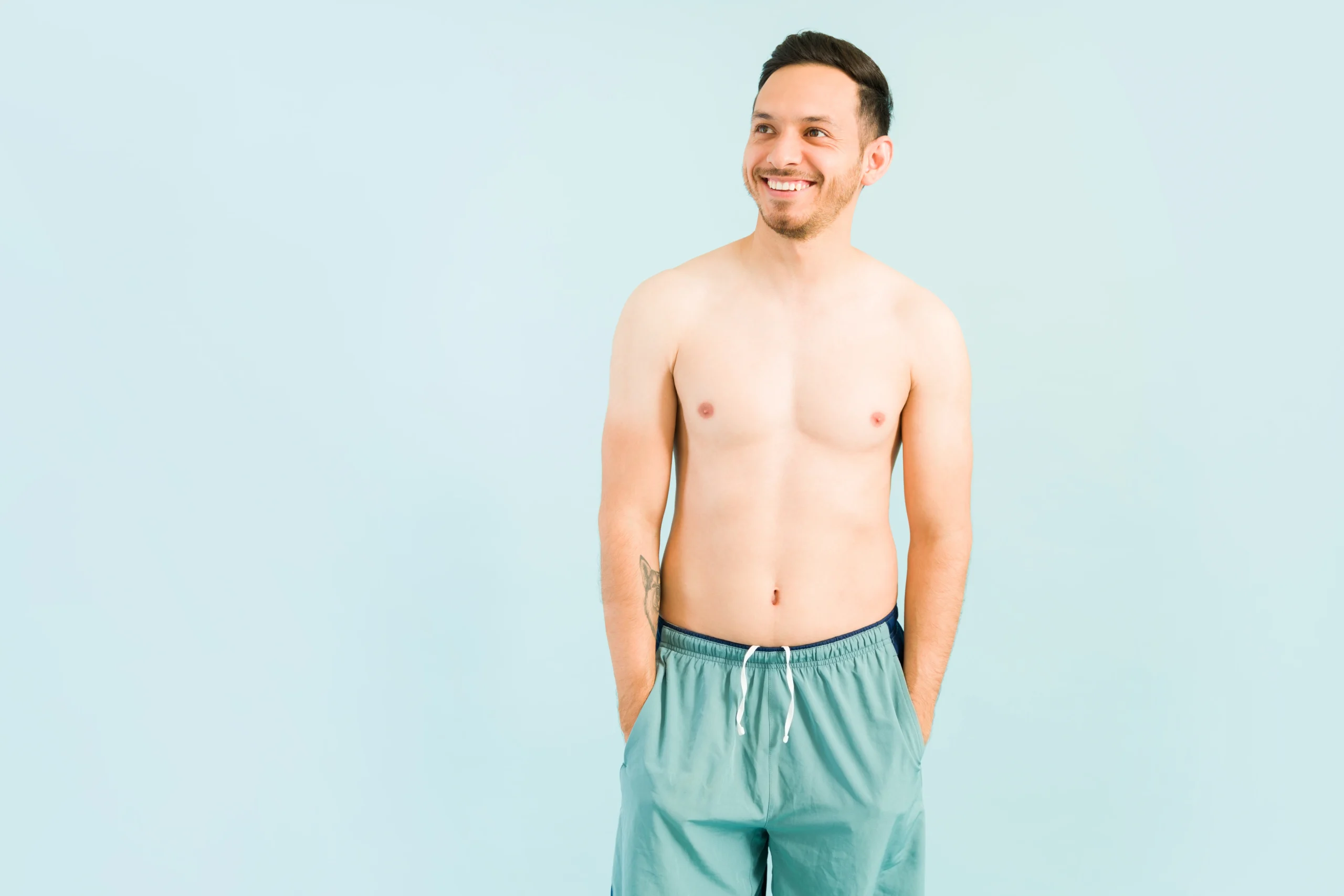 Surgeon marking patient’s chest before gynecomastia surgery in Dubai