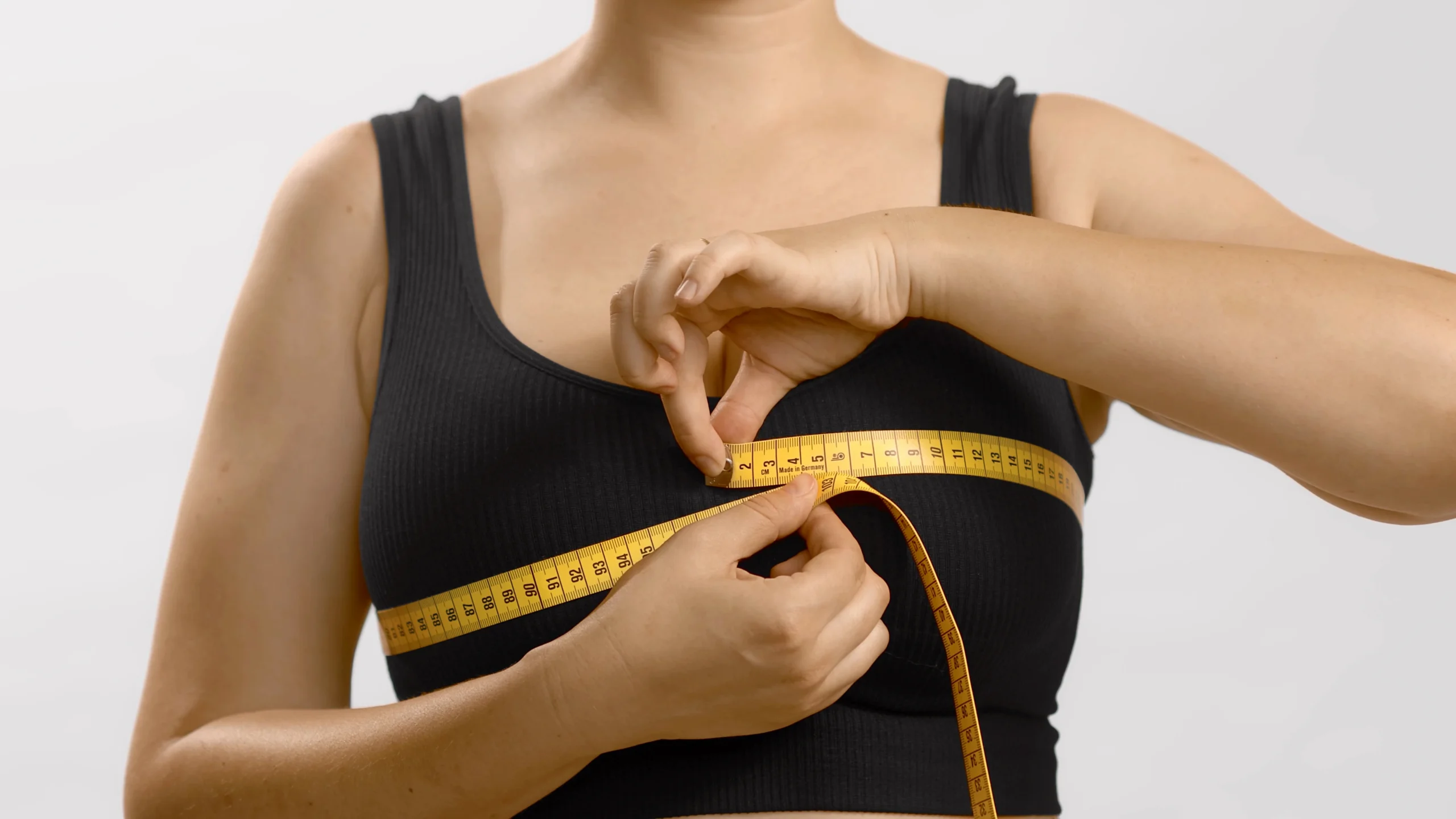 Patient consulting with surgeon about breast implants vs fat transfer in Dubai