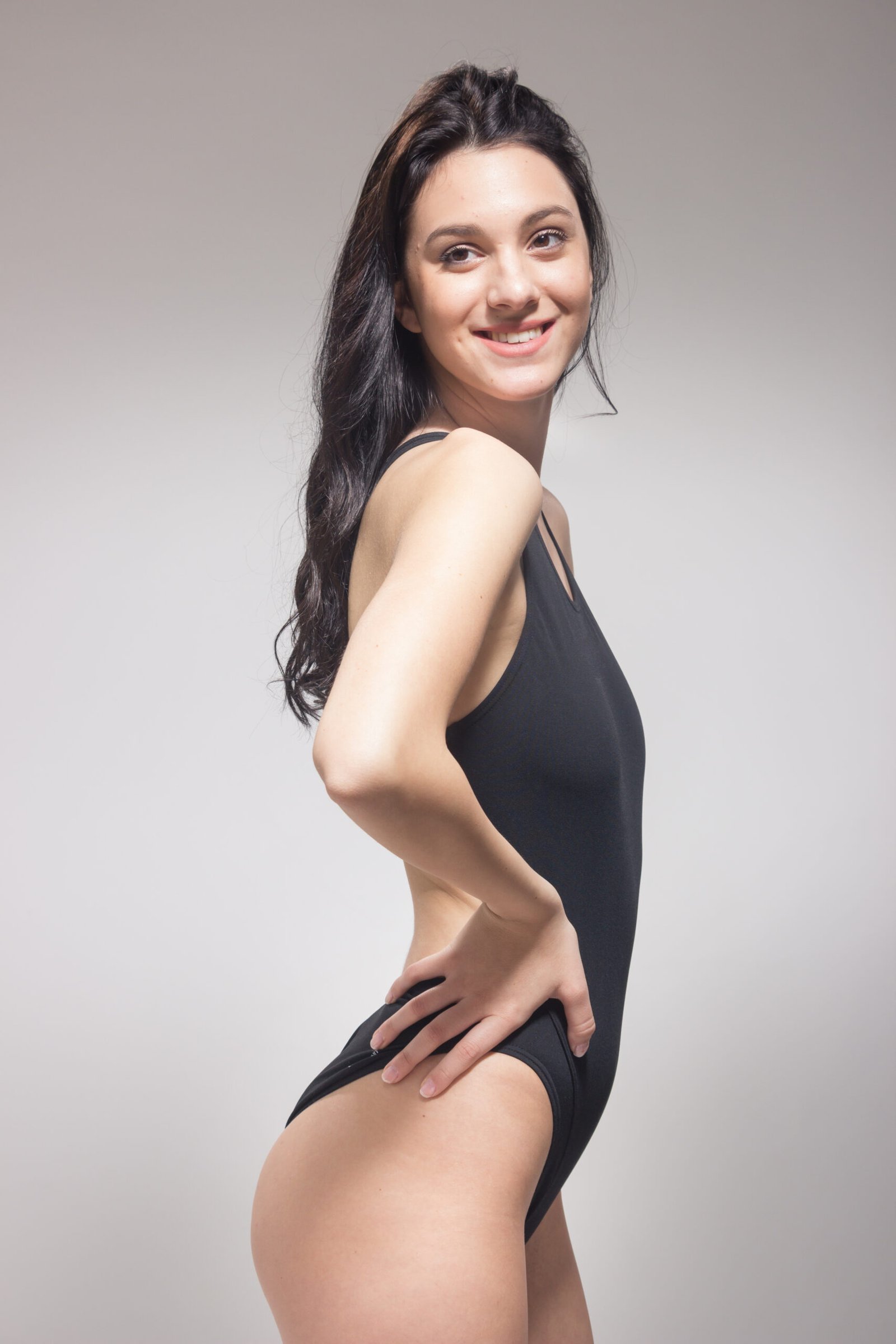 Attractive-woman-posing-in-studio-with-black-leota-2026-04-14-01-22-32-utc